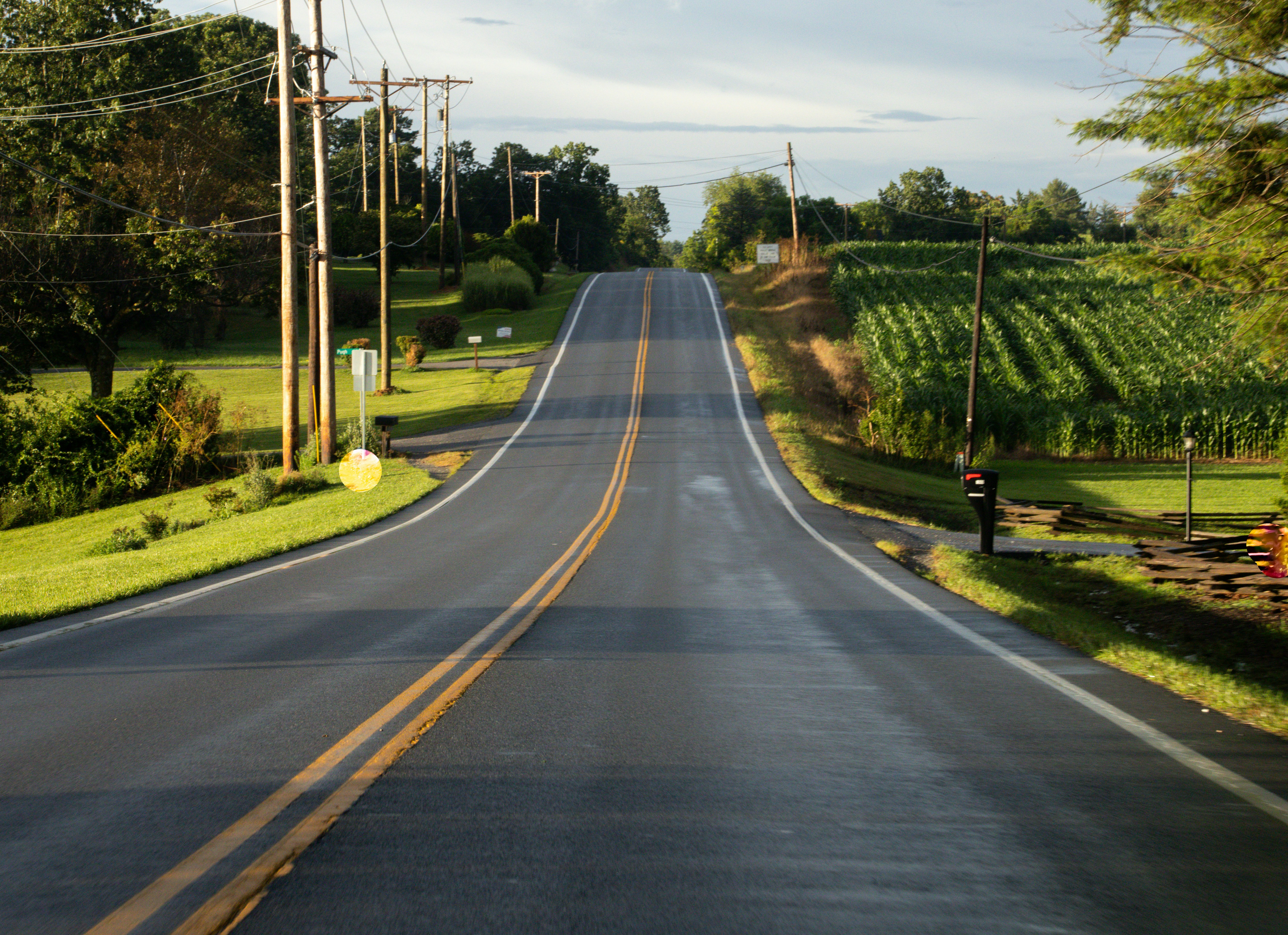 Asphalt paver laying surface course on a new road